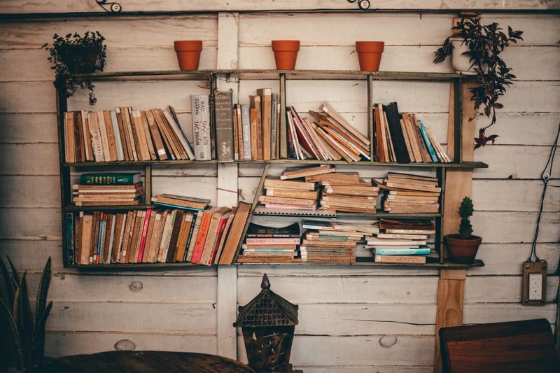 Styled bookshelf with bookends and design books
